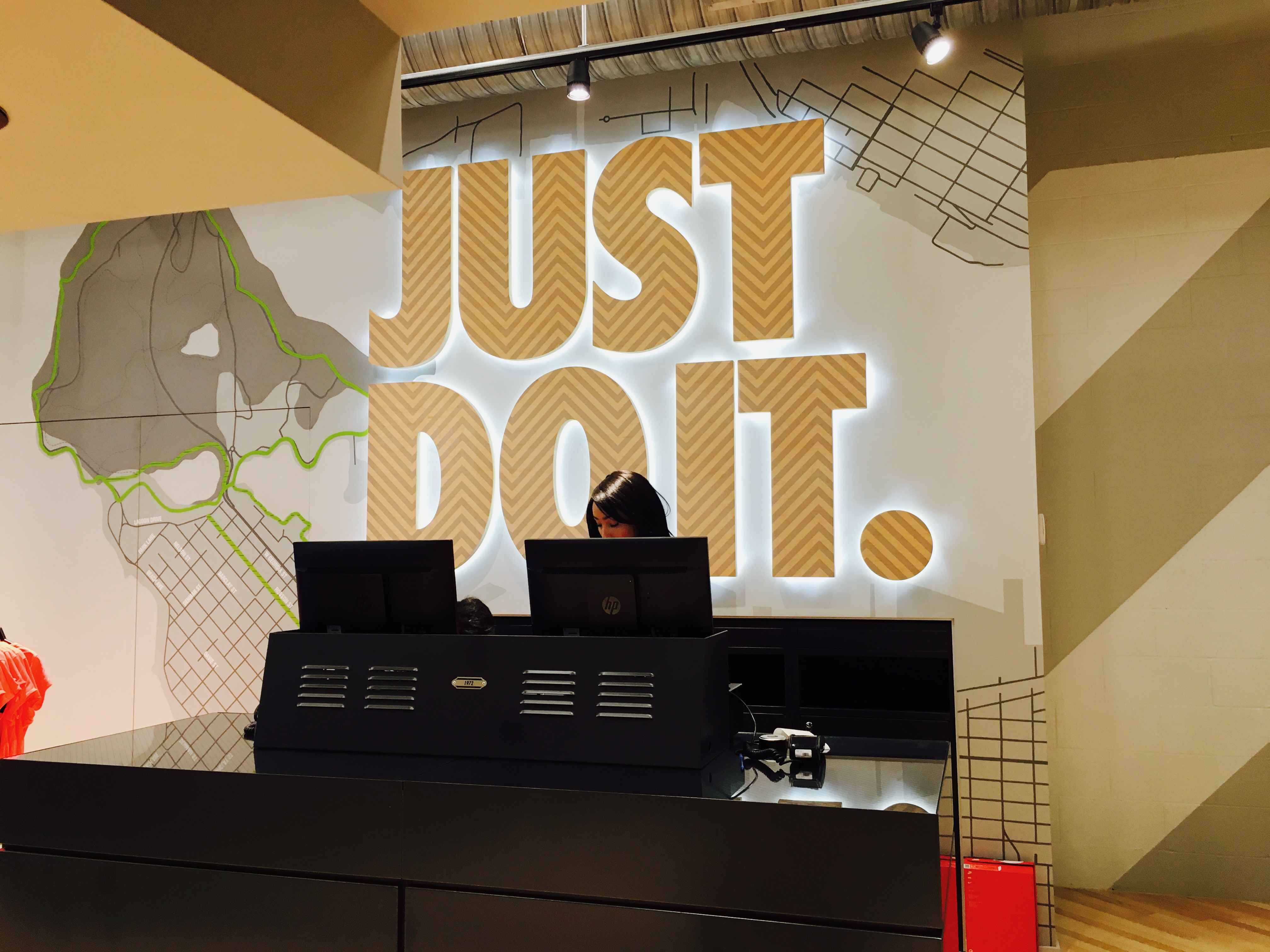 Completed Just Do It wall artwork at a Nike store